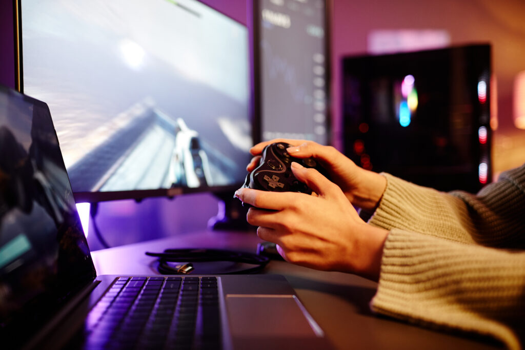 adult-using-controller-gaming-at-a-home-computer-2026-03-24-07-57-49-utc (1)