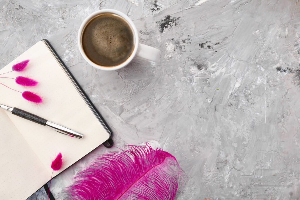 coffee-notebook-and-pen-on-textured-grey-surface-2026-03-13-04-15-27-utc