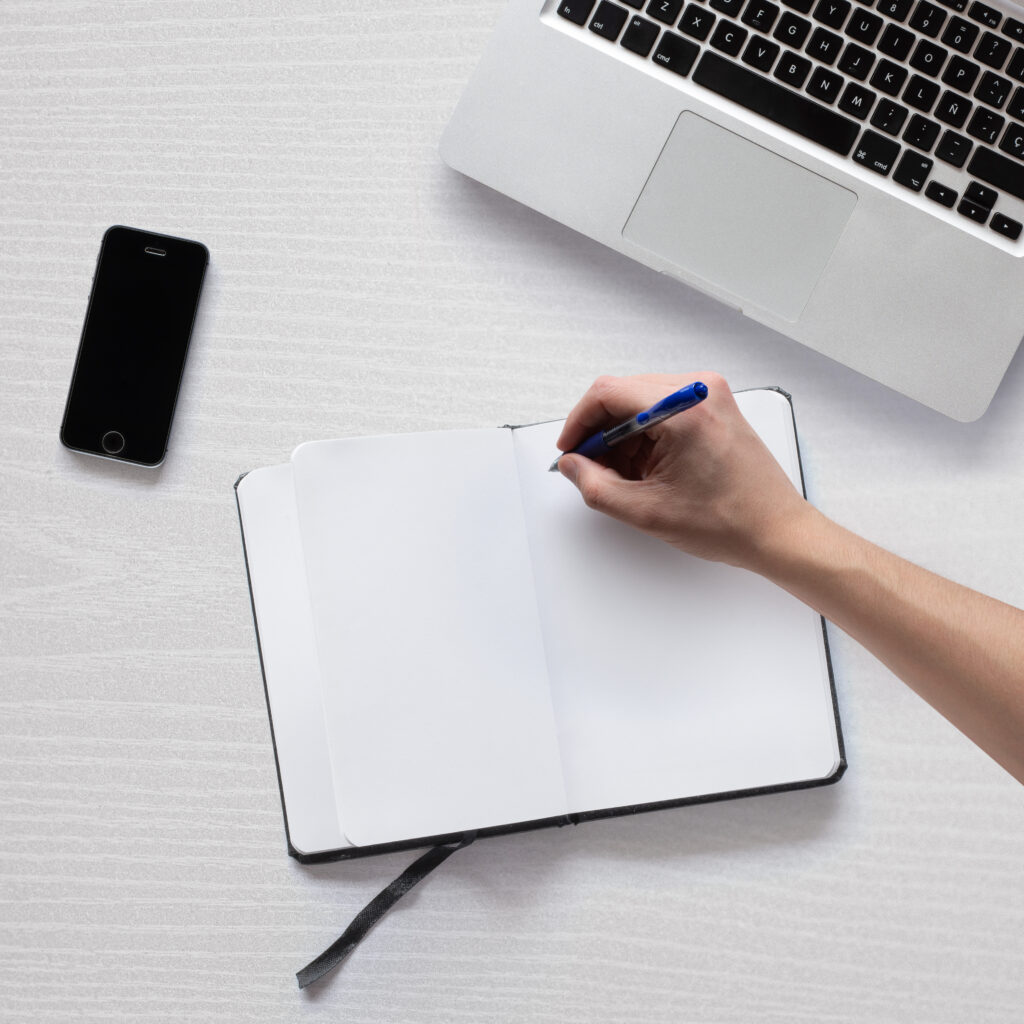 laptop-phone-and-notepad-on-clean-white-table-2026-01-07-05-36-48-utc