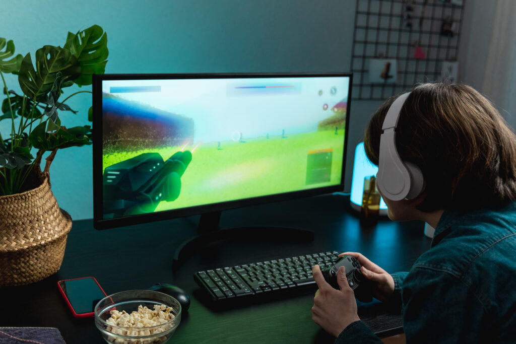 teen-gaming-with-controller-and-computer-2026-03-19-04-10-37-utc