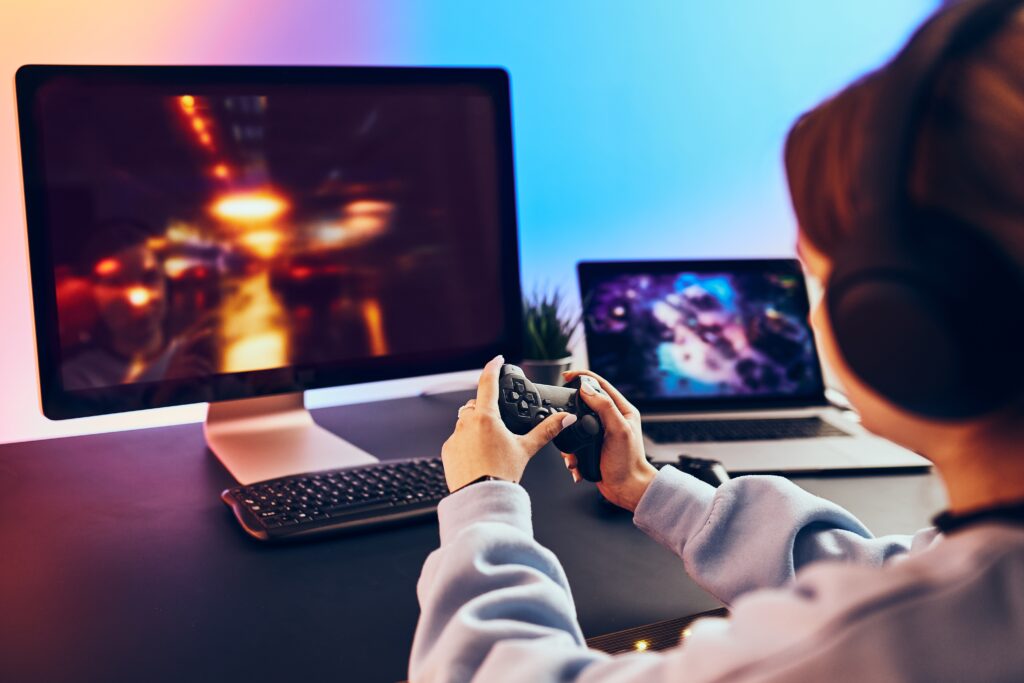 young-gamer-plays-console-with-headphones-on-desk-2026-03-24-07-09-06-utc (1)